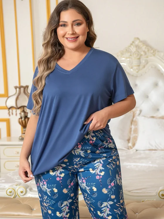 Navy V-neck top with blue botanical-print bottoms